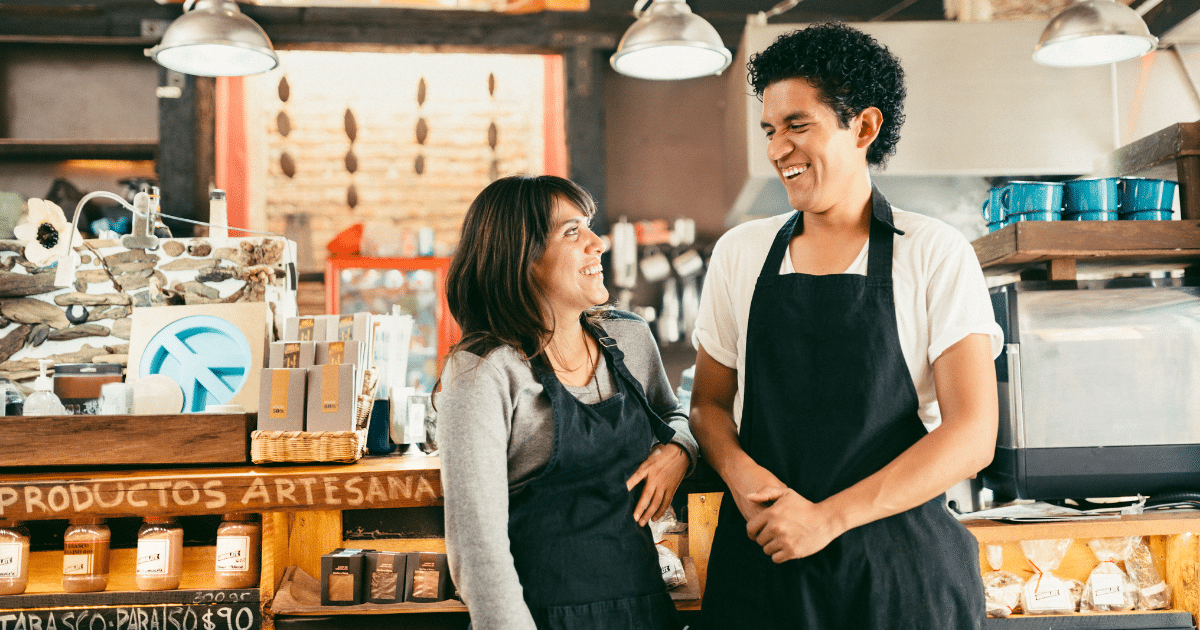 Employees enjoying a positive work environment, highlighting teamwork and employee morale in a small business setting.