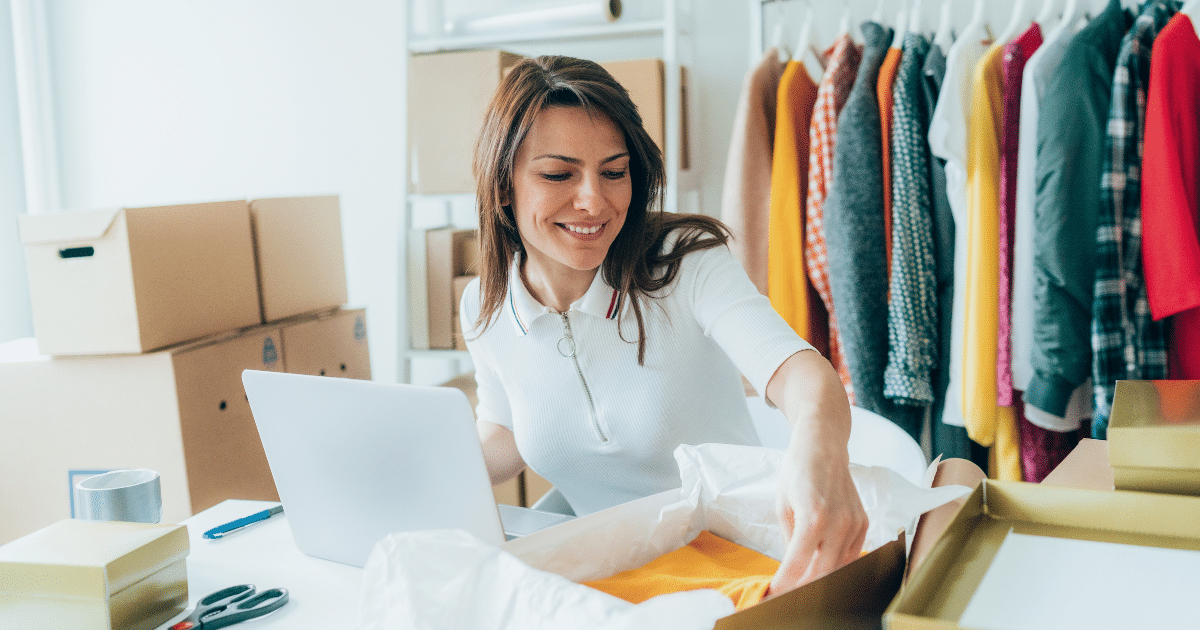 Woman managing inventory and finances for her small business, utilizing receivables factoring for cash flow.