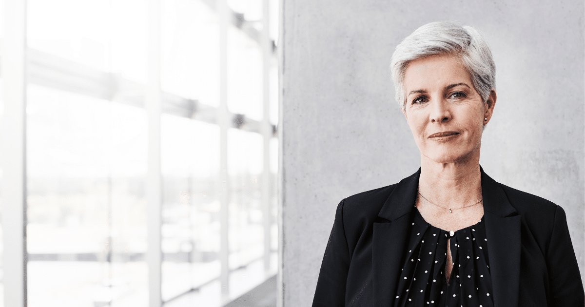 Professional woman in business attire, representing small business financing and growth opportunities.