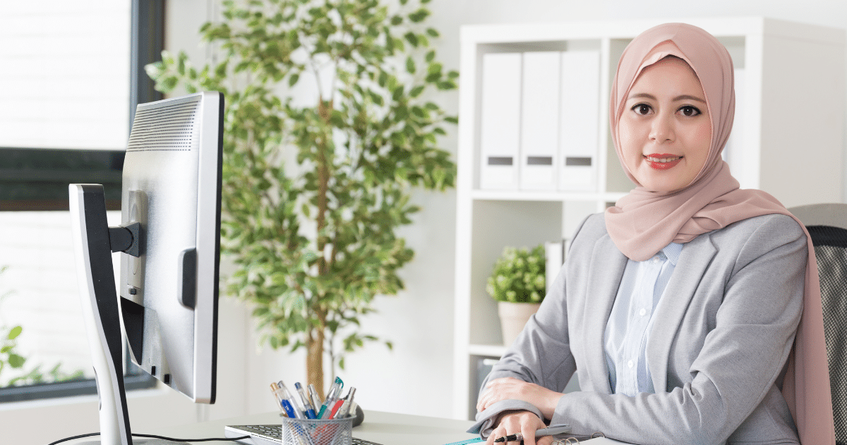 Professional woman in an office setting, highlighting the importance of mobile apps for small business growth and customer engagement.