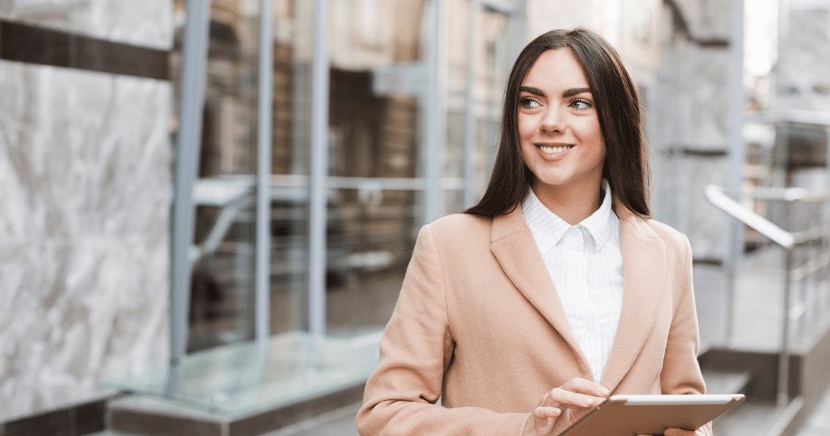 Businesswoman using technology for growth and success in a modern urban setting.