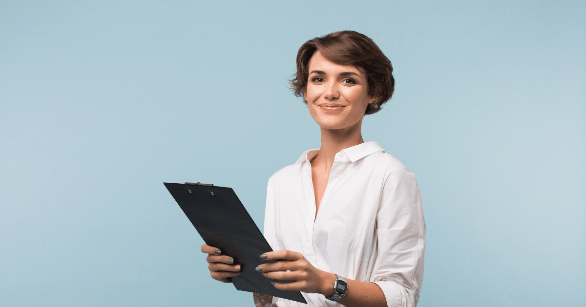 Smiling woman holding a clipboard, representing effective strategies for enhancing online conversion rates.