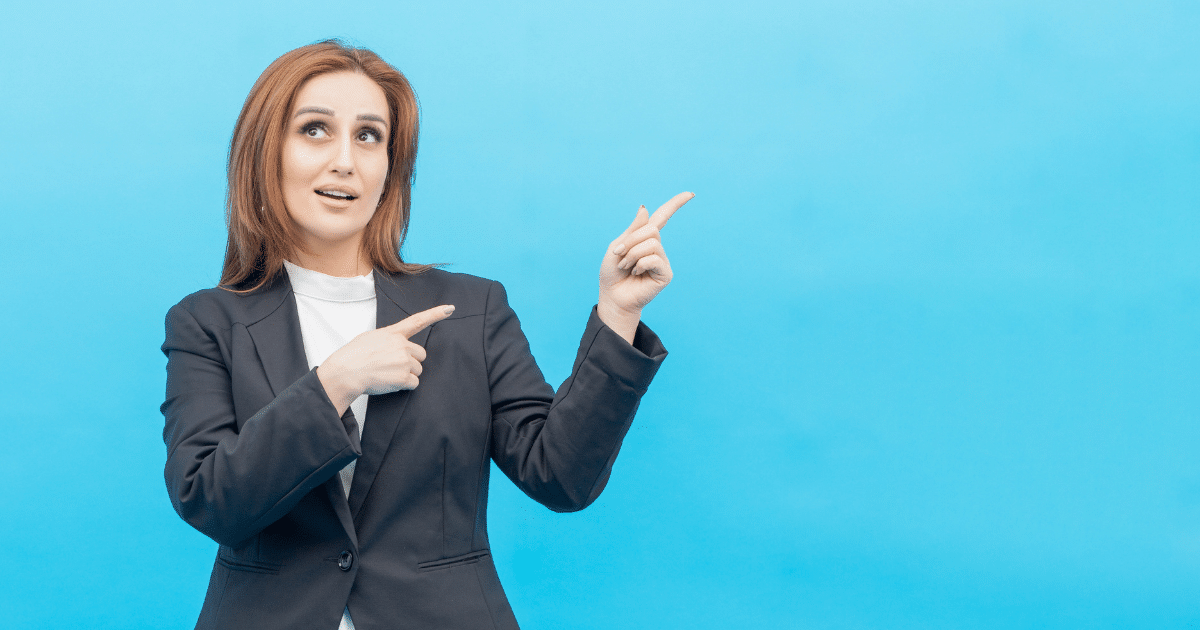 Businesswoman pointing to the side, illustrating A/B testing benefits for small business success and marketing strategies.