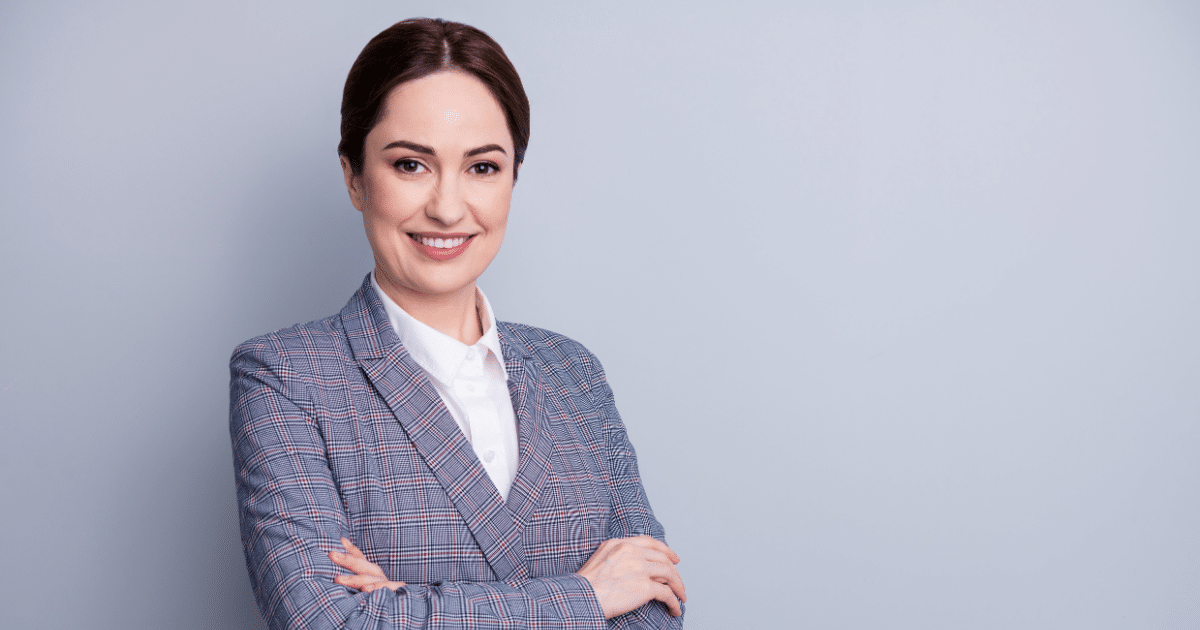 Professional woman smiling, representing effective employee training strategies for small businesses.