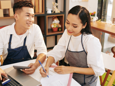 Business partners discussing unsecured loans for bad credit in a modern workspace, focusing on financial solutions.