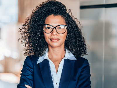 Professional woman in business attire, representing innovative holiday marketing ideas for small business growth.