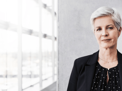 Professional woman in business attire, representing small business financing and growth opportunities.