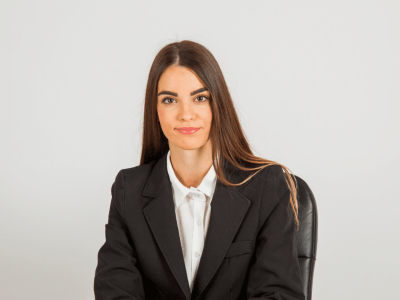 Professional woman in business attire, representing effective marketing strategies for business success.