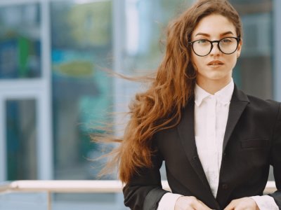 Business professional with long hair in a suit, representing strategies to rebuild bad business credit.