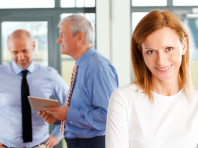 Business professionals collaborating in an office setting, emphasizing effective strategies for competition and customer engagement.