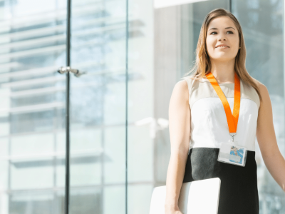 Professional woman with a business toolkit, representing essential resources for small business owners and entrepreneurs.