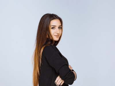 Professional woman with long hair, showcasing confidence and teamwork, ideal for hiring strategies in business.