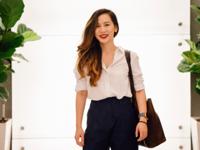 Professional woman in a modern setting, showcasing business image and credibility for small business growth.