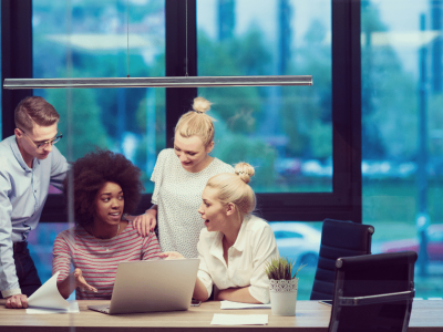 Team collaborating on small business fraud prevention strategies in a modern office setting.