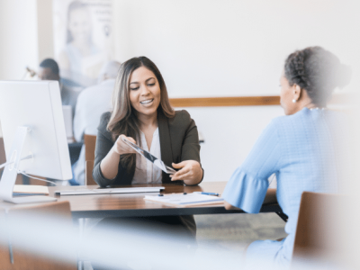 Business loan consultation with a lender, discussing application steps and financing options for small businesses.