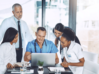 Medical professionals collaborating on business strategies, exploring unsecured credit lines for practice growth.